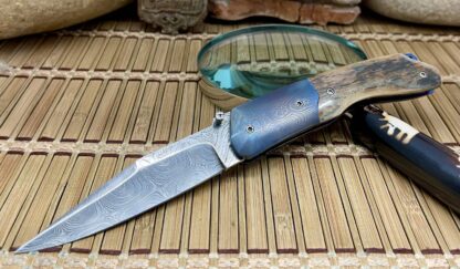 Stephen Olszewski Blue Mammoth Fossil Anodized Blue Mosaic Damascus Linerlock Knife