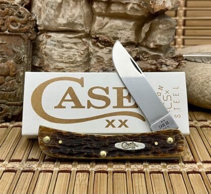 Case XX USA Peachseed Amber Bone 30092 Carbon Sod Buster Jr Knife