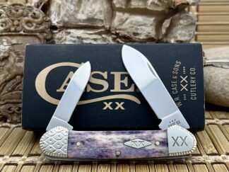 Own the Engraved Smooth Purple Appaloosa Bone Canoe, with purple bone handle, engraved bolsters, stainless blades. USA-made