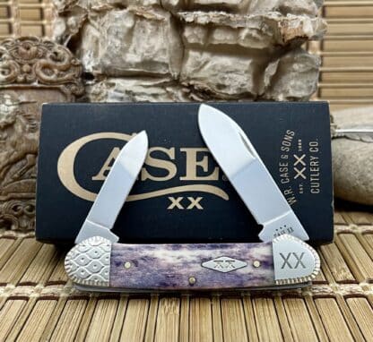Own the Engraved Smooth Purple Appaloosa Bone Canoe, with purple bone handle, engraved bolsters, stainless blades. USA-made
