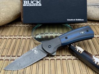 Distinctive buck black blue g10 raindrop damascus paradigm knife