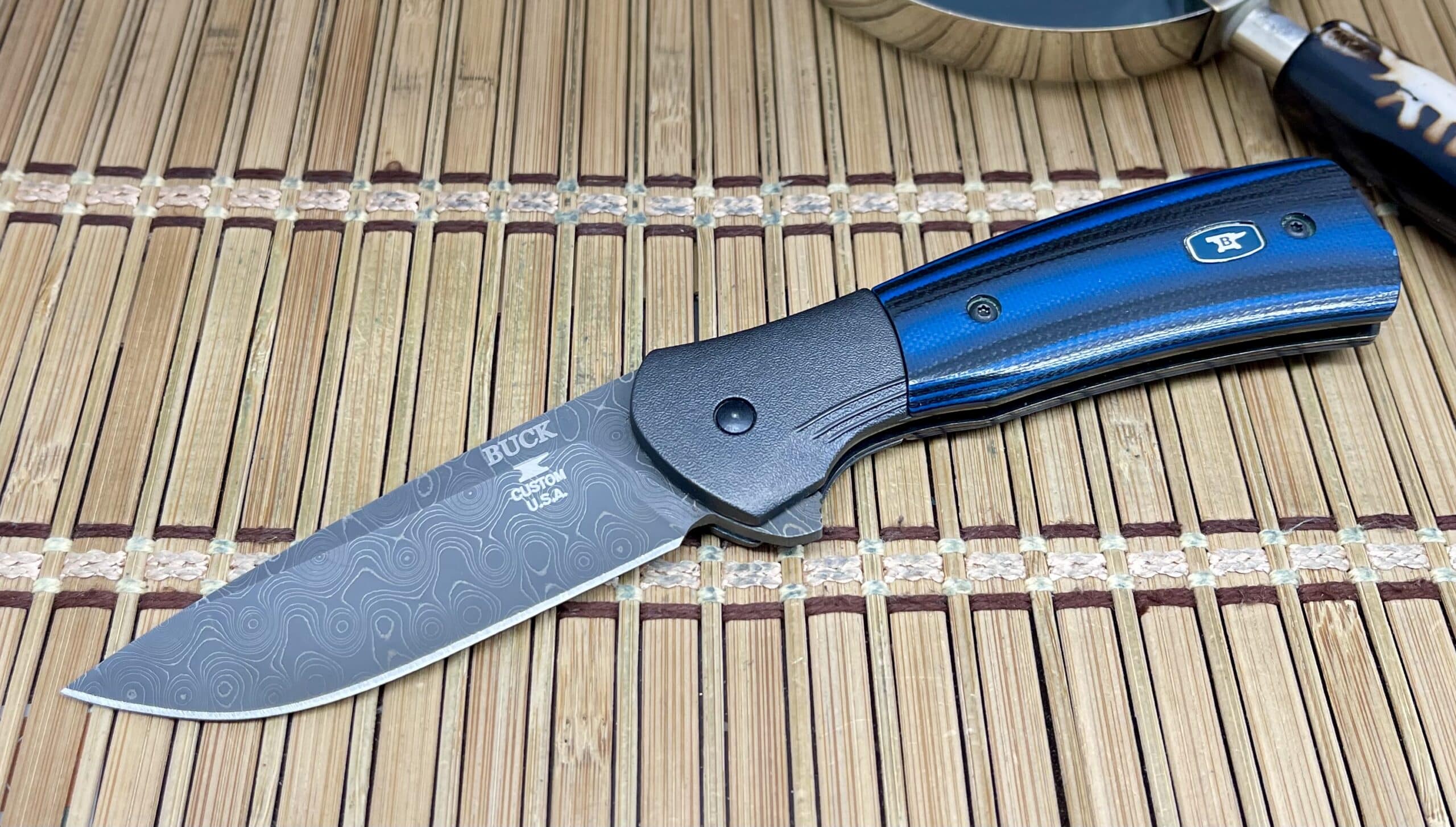 Distinctive Buck Knives Black & Blue G-10 Raindrop Damascus Paradigm Knife - Image 4