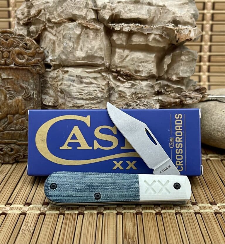 Case XX Crossroads Barlow pocket knife with a blue denim canvas handle and white bolster, shown open in front of its Case box