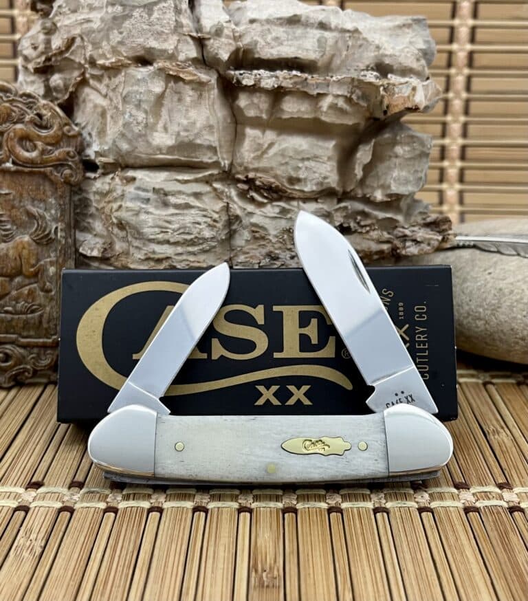 Case XX Canoe pocket knife with a smooth natural bone handle, shown open in front of its Case box