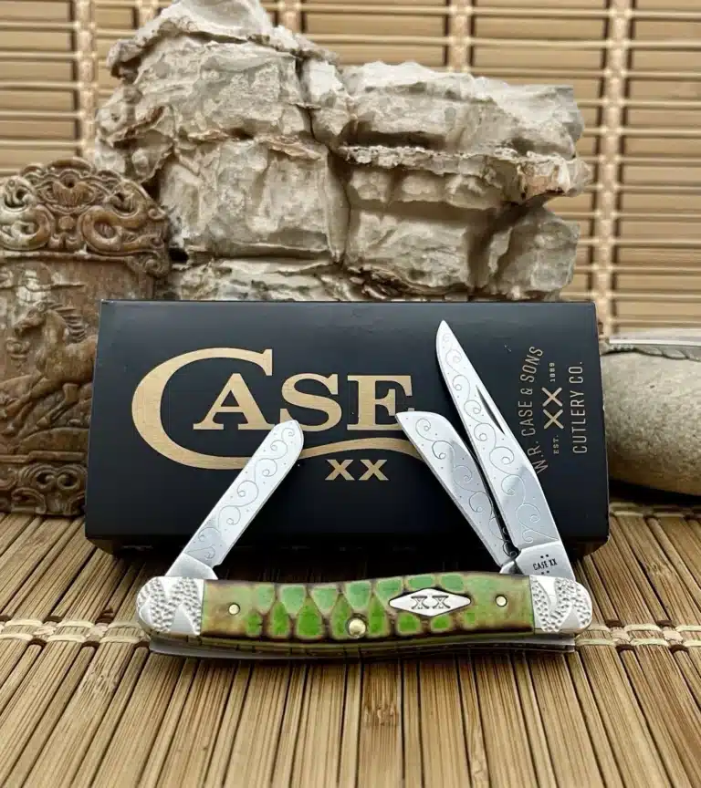 Case XX Stockman pocket knife with a bright green jigged bone handle and engraved blades, shown open in front of its Case box